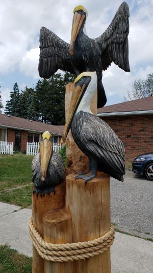 Tree sculpture of pelicans